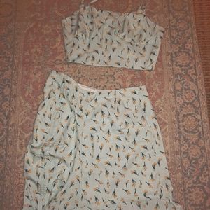 A light blue 2 piece tank and high waisted skirt